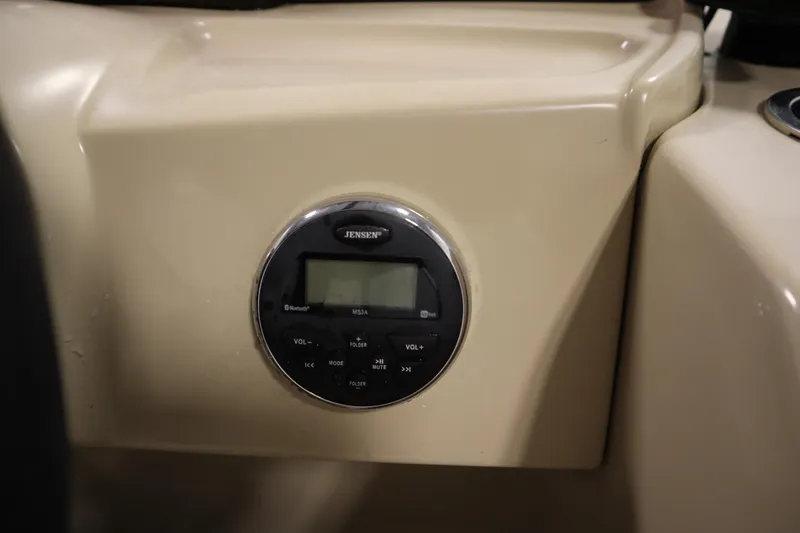 Slide: The Image of Jensen audio system on 2018 Sylvan 820 Mirage boat dashboard. - 23