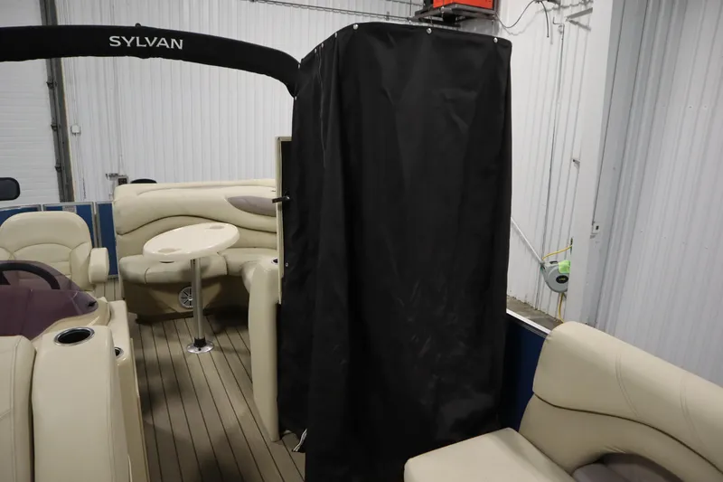 Slide: The Image of 2018 Sylvan 820 Mirage pontoon boat interior with seating and table. - 27