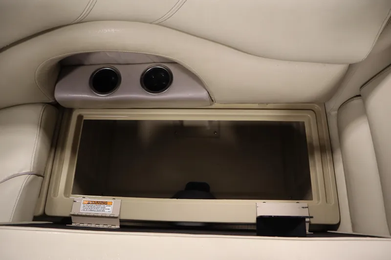 Slide: The Image of Interior storage compartment of 2018 Sylvan 820 Mirage boat with cup holders. - 29