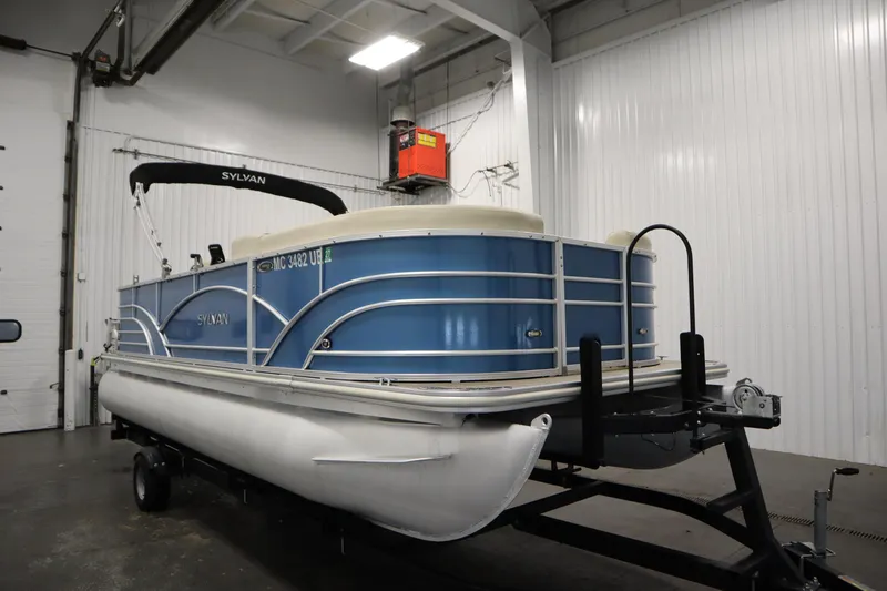Slide: The Image of 2018 Sylvan 820 Mirage pontoon boat in indoor storage on trailer. - 3