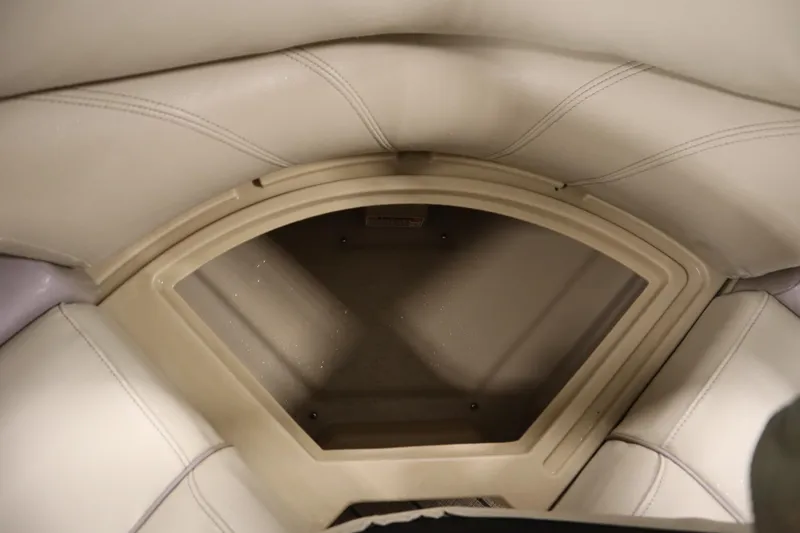 Slide: The Image of 2018 Sylvan 820 Mirage boat interior storage compartment with beige upholstery. - 30