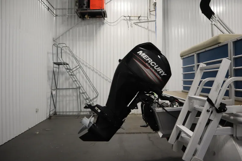 Slide: The Image of 2018 Sylvan 820 Mirage with Mercury outboard motor in storage facility. - 36