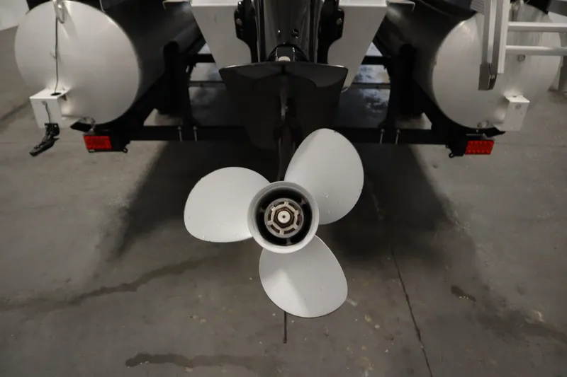 Slide: The Image of Propeller of a 2018 Sylvan 820 Mirage pontoon boat in a garage setting. - 37