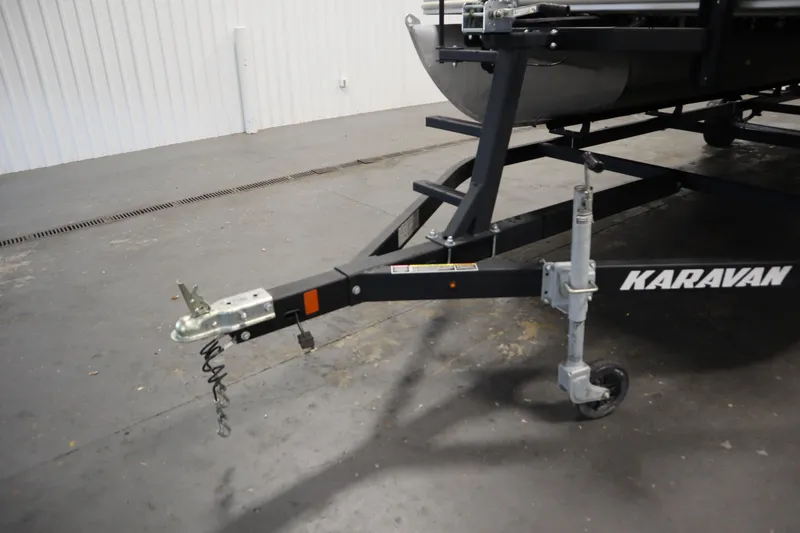 Slide: The Image of Trailer hitch of a 2018 Sylvan 820 Mirage boat on a Karavan trailer. - 39