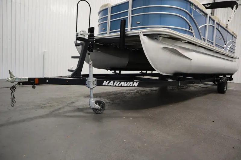 Slide: The Image of 2018 Sylvan 820 Mirage pontoon boat on Karavan trailer in indoor storage. - 40