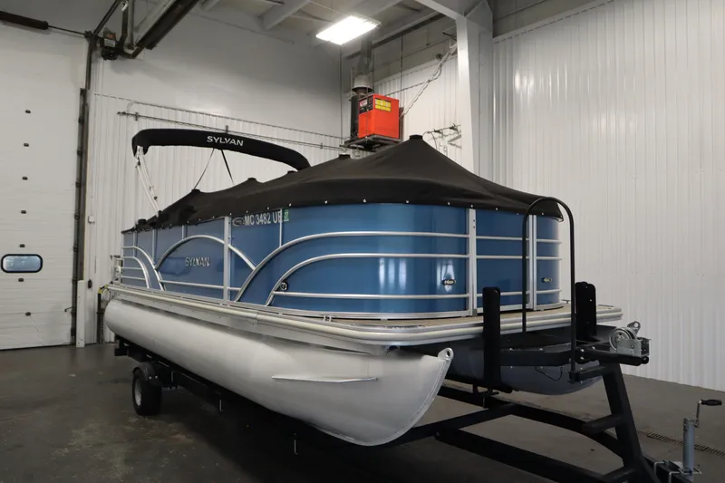 Slide: The Image of 2018 Sylvan 820 Mirage pontoon boat in indoor storage on a trailer. - 42