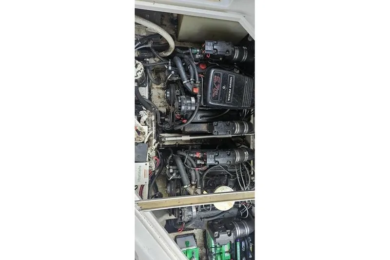 Slide: The Image of 1997 Chris-Craft 30 Crowne engine compartment with dual inboard motors and wiring. - 2