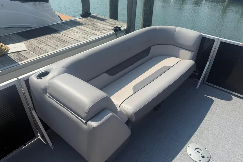 Slide: The Image of 2022 Princecraft Vectra 23 RL pontoon boat with gray seating and cup holder. - 11