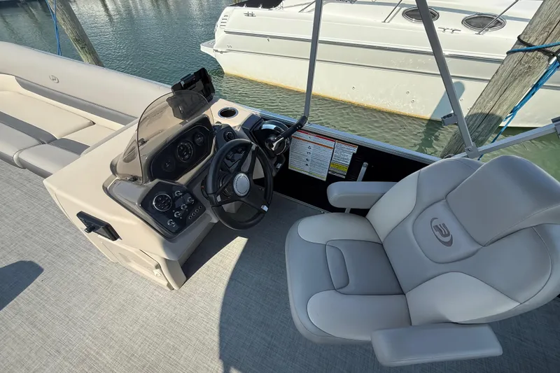 Slide: The Image of 2022 Princecraft Vectra 23 RL boat interior with steering console and seating. - 13