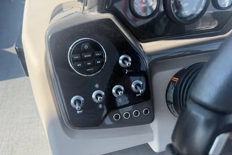 Slide: The Image of Control panel of 2022 Princecraft Vectra 23 RL boat with switches and gauges. - 15