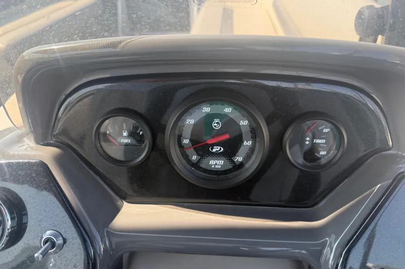 Slide: The Image of Dashboard of 2022 Princecraft Vectra 23 RL boat showing fuel, RPM, and trim gauges. - 16