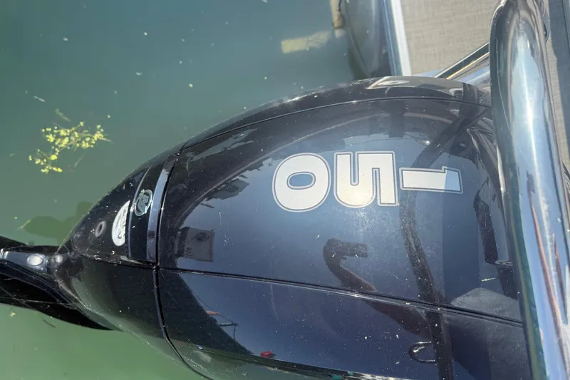 Slide: The Image of Outboard motor on a 2022 Princecraft Vectra 23 RL boat, docked on water. - 17