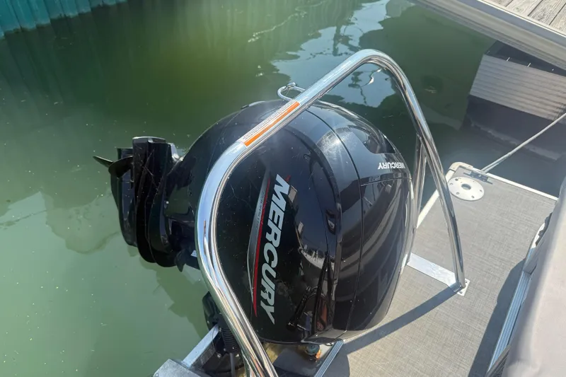 Slide: The Image of 2022 Princecraft Vectra 23 RL with Mercury outboard motor at dockside. - 18