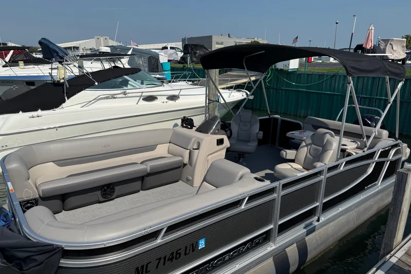 Slide: The Image of 2022 Princecraft Vectra 23 RL pontoon boat docked at marina, featuring spacious seating. - 3
