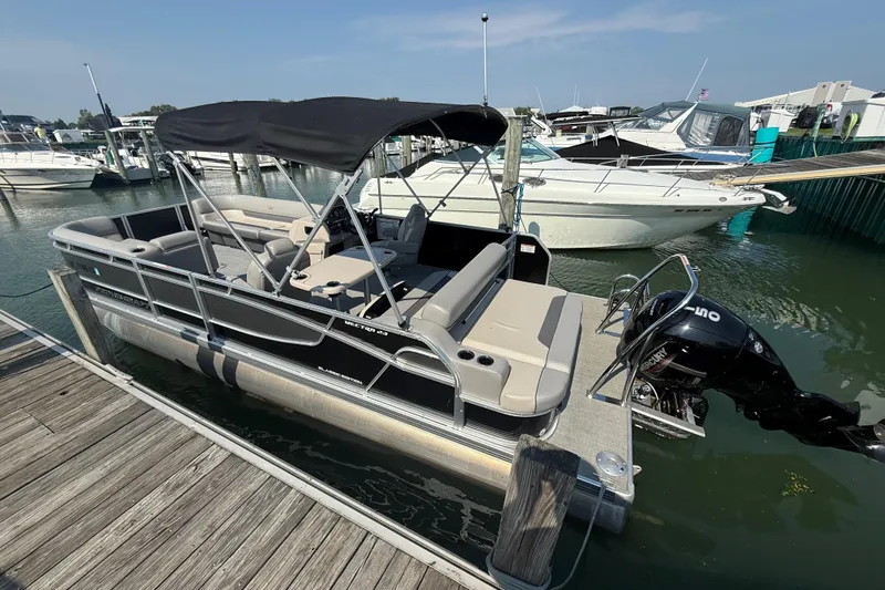 Slide: The Image of 2022 Princecraft Vectra 23 RL pontoon boat docked at marina. - 4