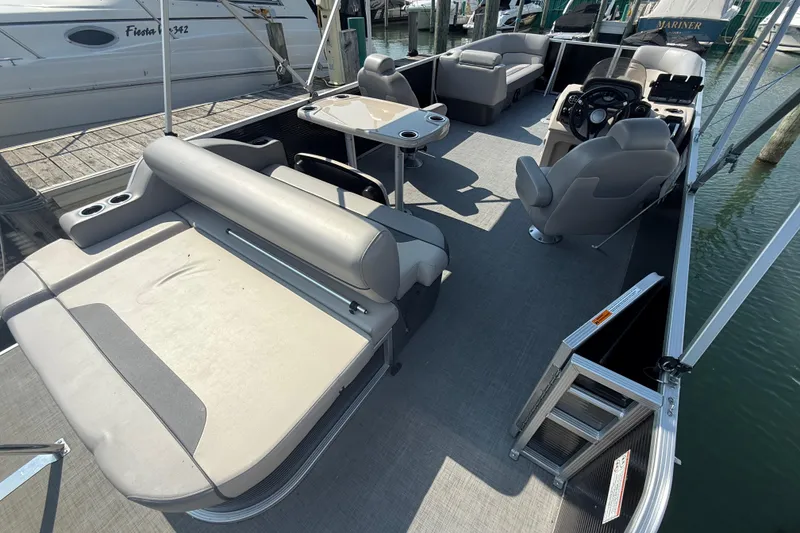 Slide: The Image of 2022 Princecraft Vectra 23 RL pontoon boat interior with seating and helm. - 5