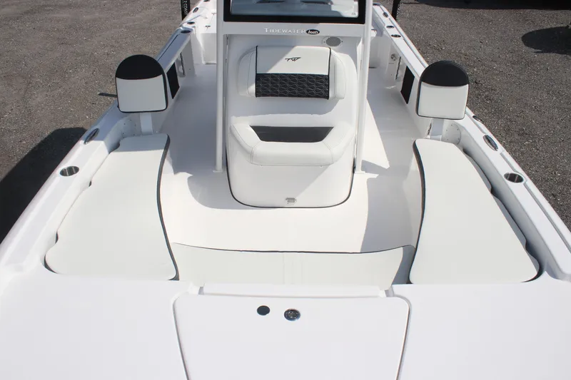 Slide: The Image of 2026 Tidewater 2210 Carolina Bay boat interior with white seating and console. - 19
