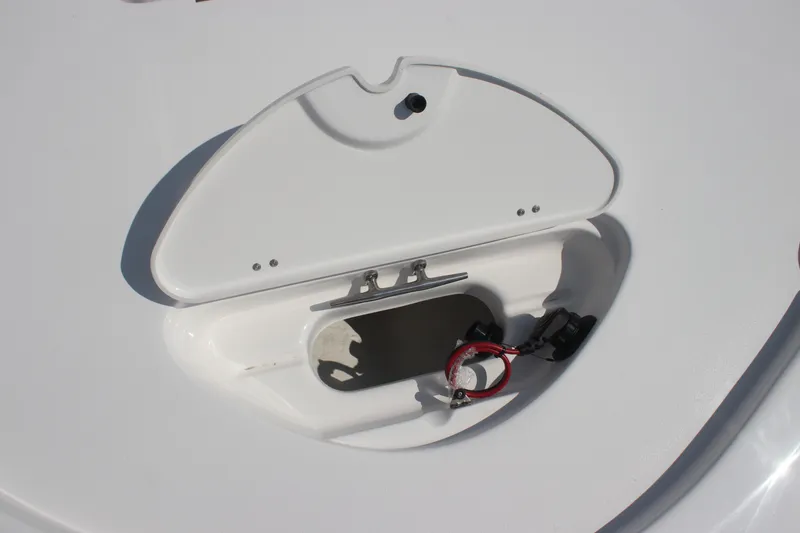 Slide: The Image of 2026 Tidewater 2210 Carolina Bay boat compartment with open hatch and wiring. - 20