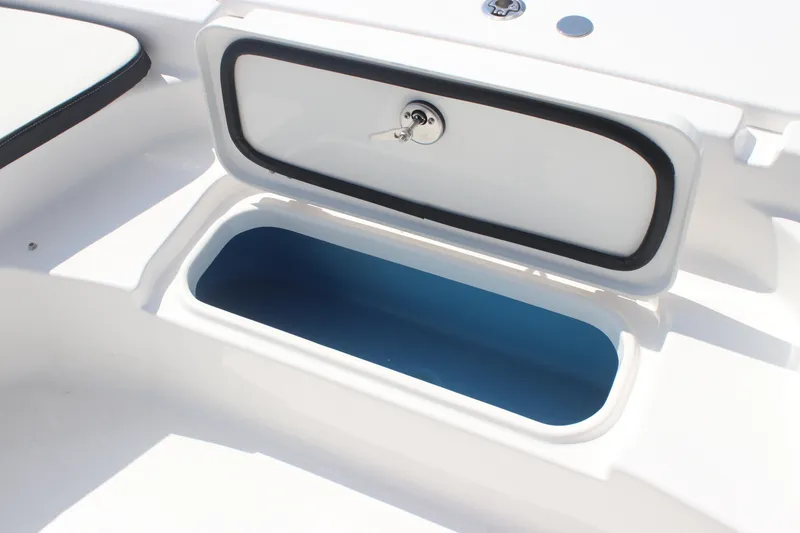 Slide: The Image of Open storage compartment on 2026 Tidewater 2210 Carolina Bay boat. - 23