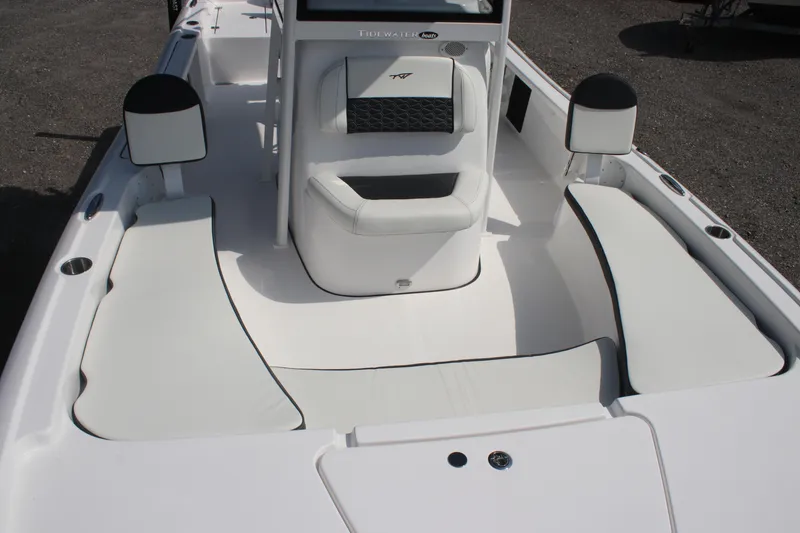 Slide: The Image of 2026 Tidewater 2210 Carolina Bay boat interior with white seating and console. - 24