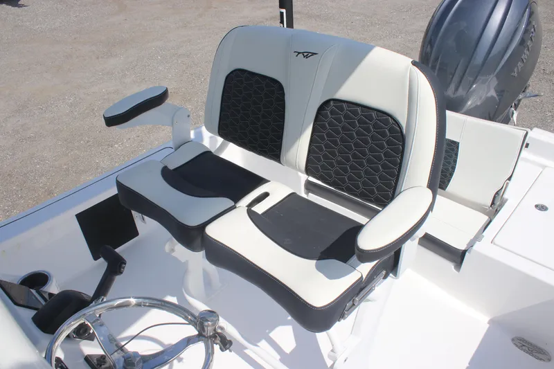 Slide: The Image of 2026 Tidewater 2210 Carolina Bay boat seating with black and white upholstery. - 9