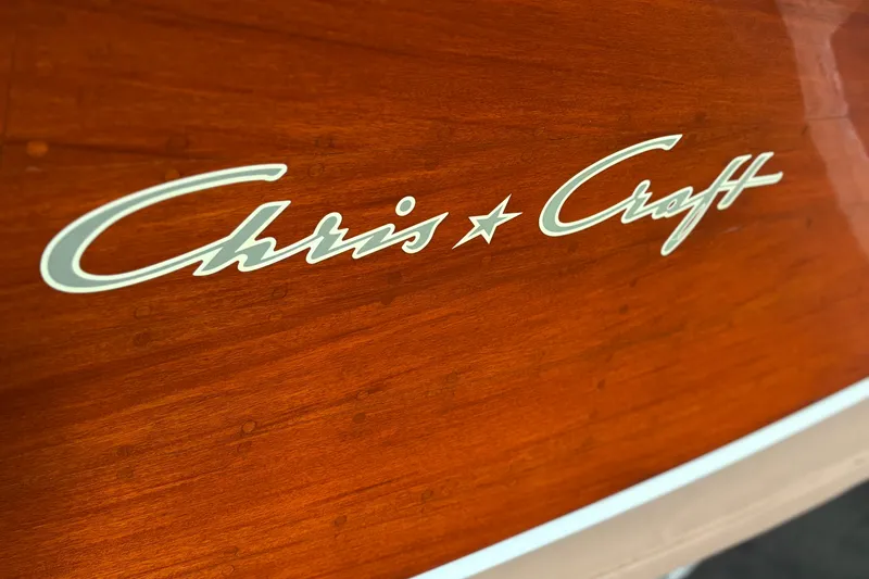 Slide: The Image of 1947 Chris Craft Barrel Back boat with elegant wood finish and logo detail. - 3
