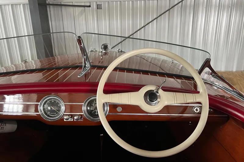 Slide: The Image of 1947 Chris Craft Barrel Back boat dashboard with vintage steering wheel and gauges. - 5