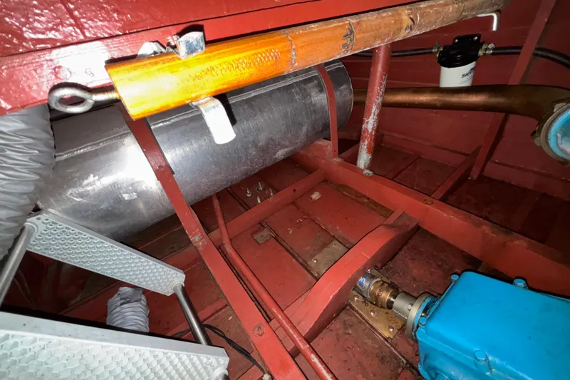 Slide: The Image of 1947 Chris Craft Barrel Back engine compartment with visible components and red interior. - 9