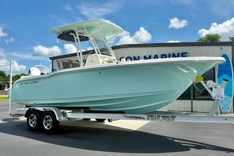 The Image of 2026 Key West 239 FS boat on trailer, displayed outdoors under blue sky. - 0