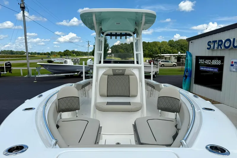 Slide: The Image of 2026 Key West 239 FS boat interior with cushioned seating and sleek design. - 14