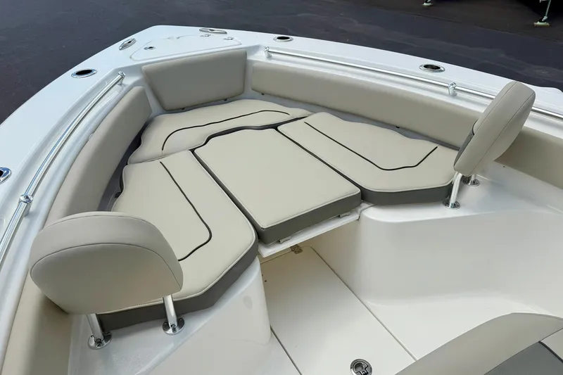 Slide: The Image of 2026 Key West 239 FS boat interior with cushioned seating and cup holders. - 15