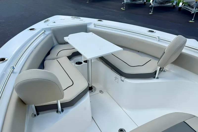 Slide: The Image of 2026 Key West 239 FS boat interior with cushioned seating and sleek design. - 17
