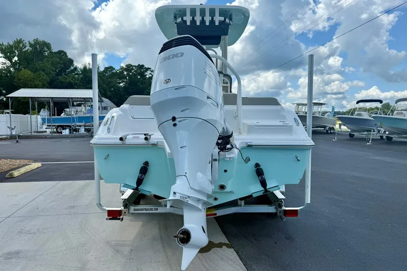 Slide: The Image of 2026 Key West 239 FS boat dashboard with steering wheel and navigation controls. - 2