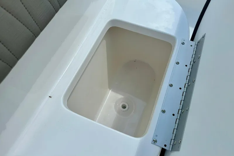 Slide: The Image of 2026 Key West 239 FS boat interior with steering console and seating area. - 23