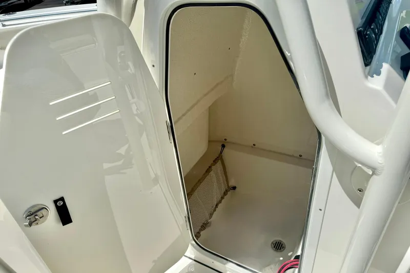 Slide: The Image of 2026 Key West 239 FS boat with luxurious gray seating and armrests. - 28