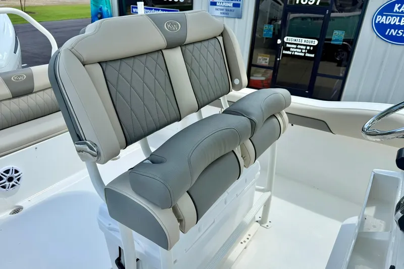 Slide: The Image of 2026 Key West 239 FS boat interior with helm, seating, and cooler. - 29