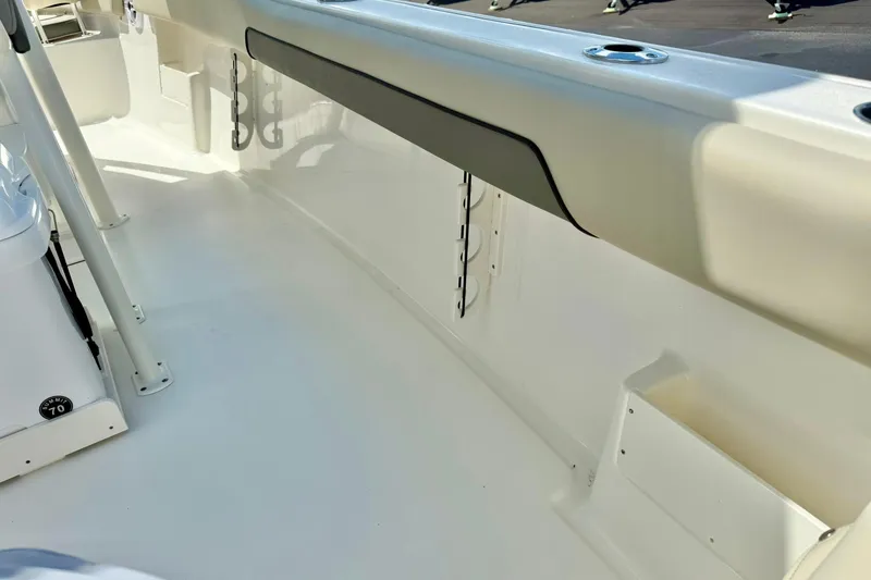 Slide: The Image of 2026 Key West 239 FS boat interior with cushioned seating and speaker system. - 34