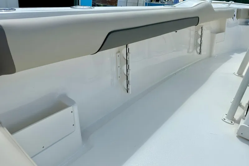 Slide: The Image of 2026 Key West 239 FS boat interior with cushioned seating and speakers. - 35