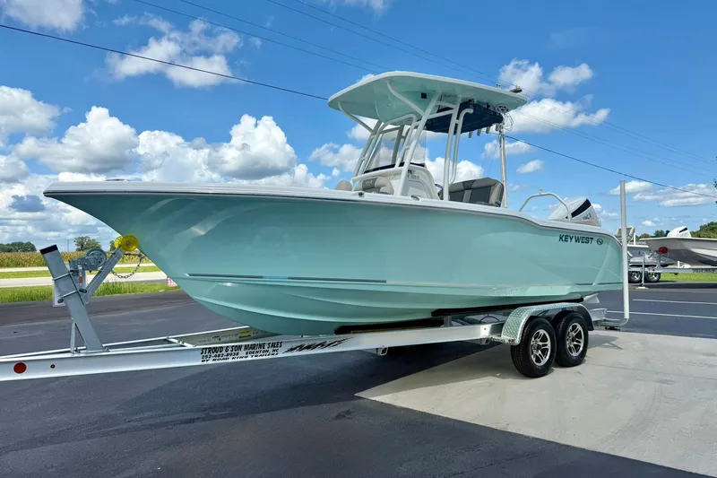 Slide: The Image of 2026 Key West 239 FS boat on trailer at Stroud & Son Marine dealership. - 5