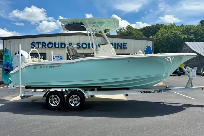 Slide: The Image of 2026 Key West 239 FS boat on trailer, sunny day, dealership background. - 6