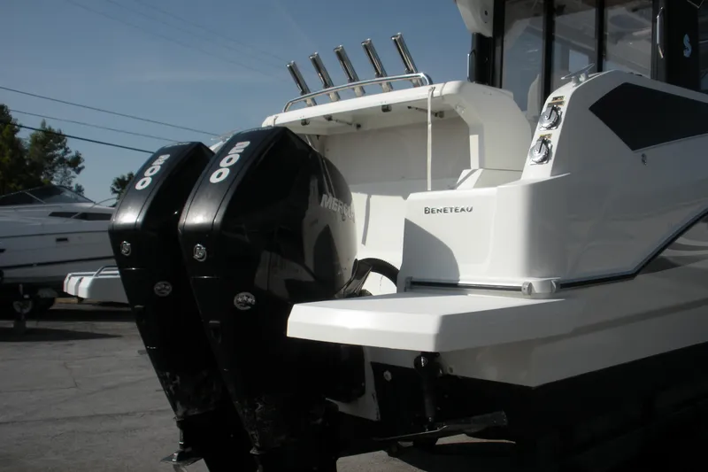 Slide: The Image of 2019 Beneteau Barracuda 9 with dual Mercury outboard engines, docked outdoors. - 21