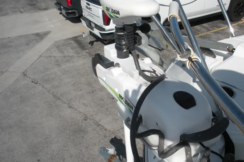 Slide: The Image of Close-up of a 2019 Beneteau Barracuda 9 boat motor in a parking lot. - 5