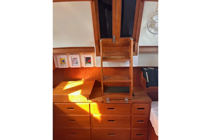 Slide: The Image of Interior of 1984 Grand Banks 42 Classic yacht with wooden cabinetry and ladder. - 12