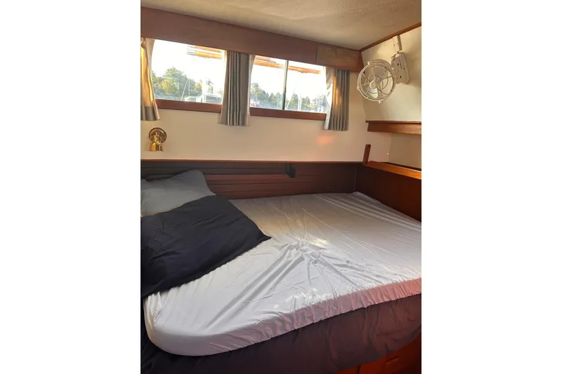 Slide: The Image of Cozy bedroom interior of 1984 Grand Banks 42 Classic yacht with window view. - 14