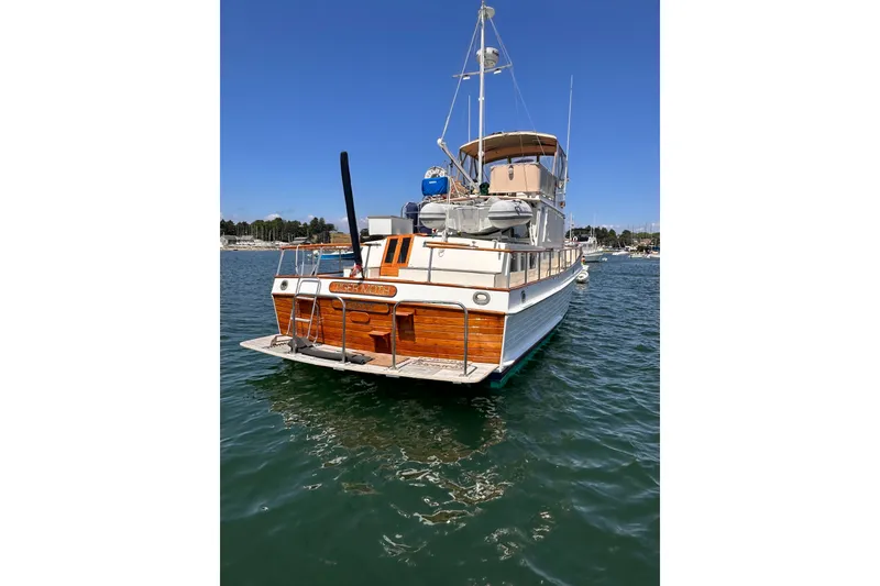 Slide: The Image of Interior of 1984 Grand Banks 42 Classic yacht with wooden finish and beige seating. - 2