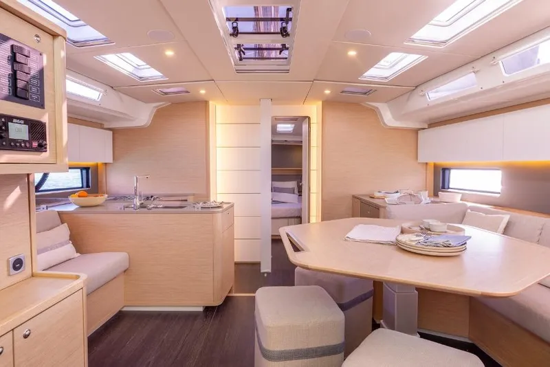 Slide: The Image of Luxurious interior of 2026 Dufour 48 yacht with modern kitchen and dining area. - 32