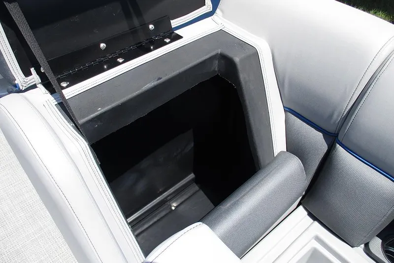 Slide: The Image of 2026 Bentley Pontoons Legacy 220 Quad Swingback storage compartment with open lid. - 14