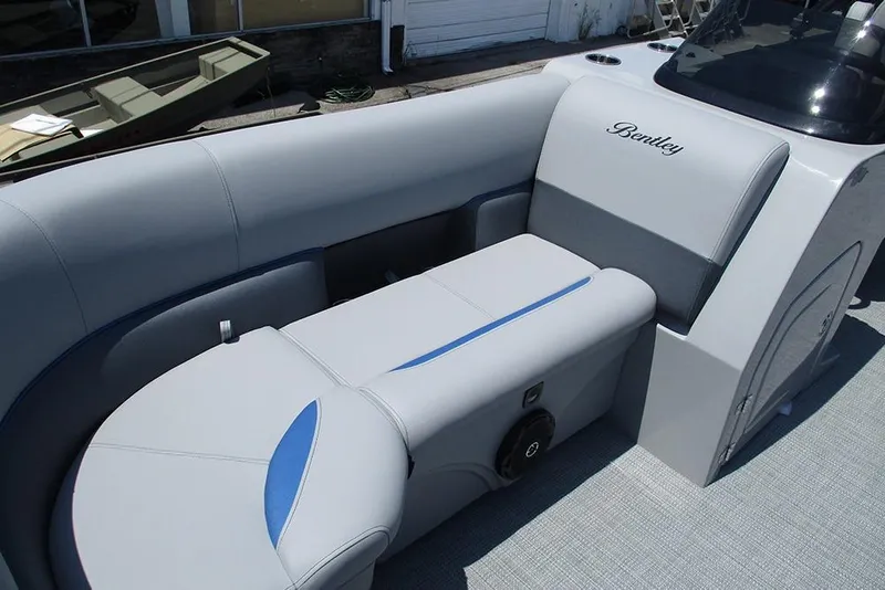 Slide: The Image of 2026 Bentley Pontoons Legacy 220 Quad Swingback interior with luxurious seating and sleek design. - 15