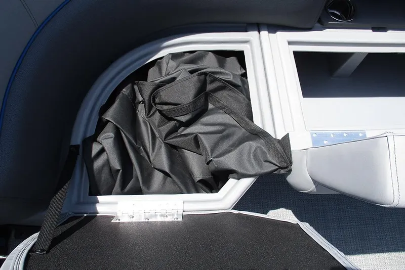 Slide: The Image of Storage compartment in 2026 Bentley Pontoons Legacy 220 Quad Swingback with black fabric bag. - 17