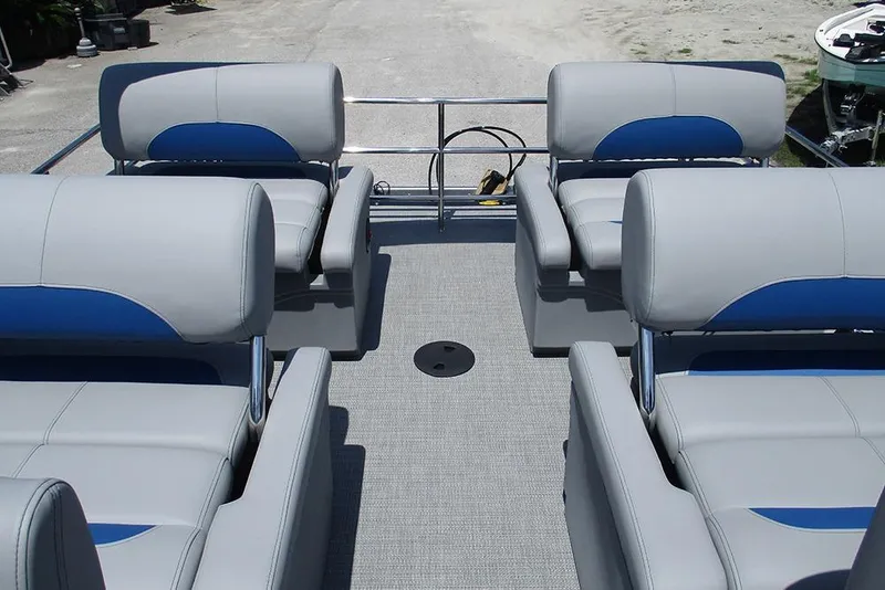 Slide: The Image of 2026 Bentley Pontoons Legacy 220 Quad Swingback interior with gray and blue seating. - 19